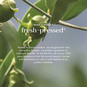 Green leaves with text about fresh-pressed ingredients and their sourcing process.