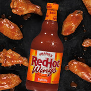 Lifestyle/use image: Franks RedHot buffalo sauce used on wings and food bottle 680ml