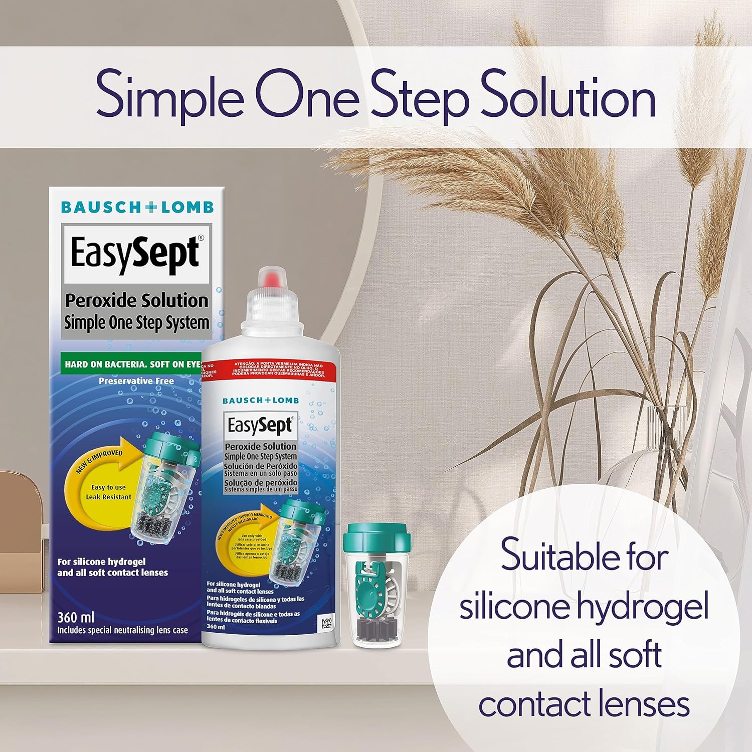 Bausch & Lomb EasySept contact lens solution packaging with a vase of dried plants in the background.
