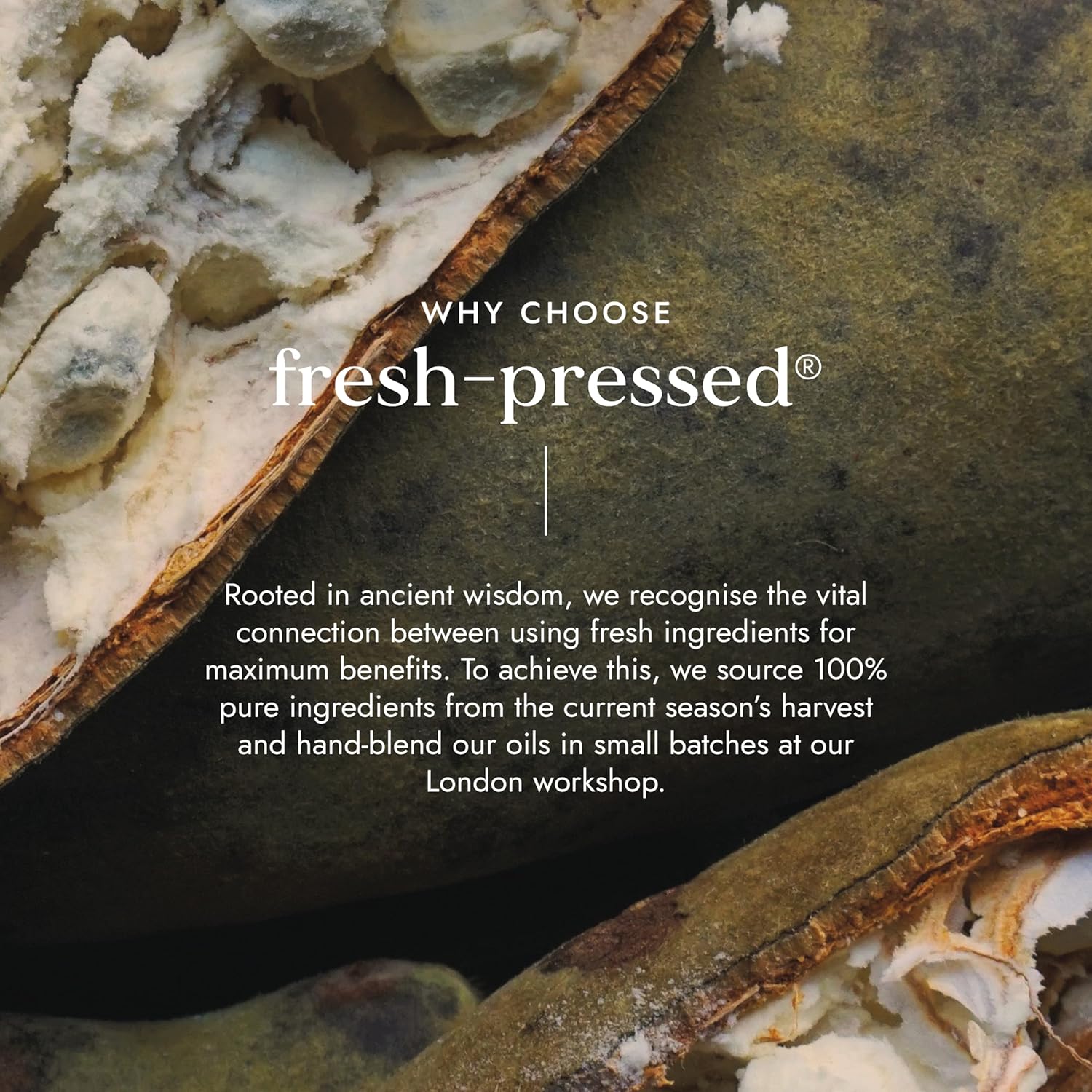 Close-up of a fresh-opened fruit with text about 'fresh-pressed' products on a dark background.