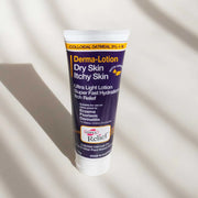 Tube of Derma-Lotion for dry skin and itchy skin on a light background
