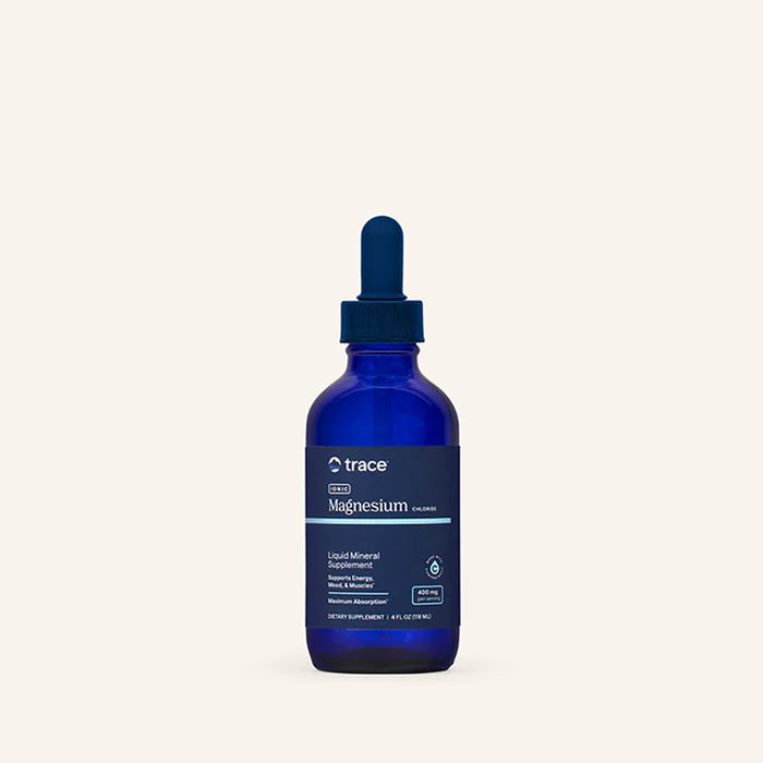 Blue bottle of trace magnesium supplement on a white background
