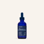 Blue bottle of trace magnesium supplement on a white background