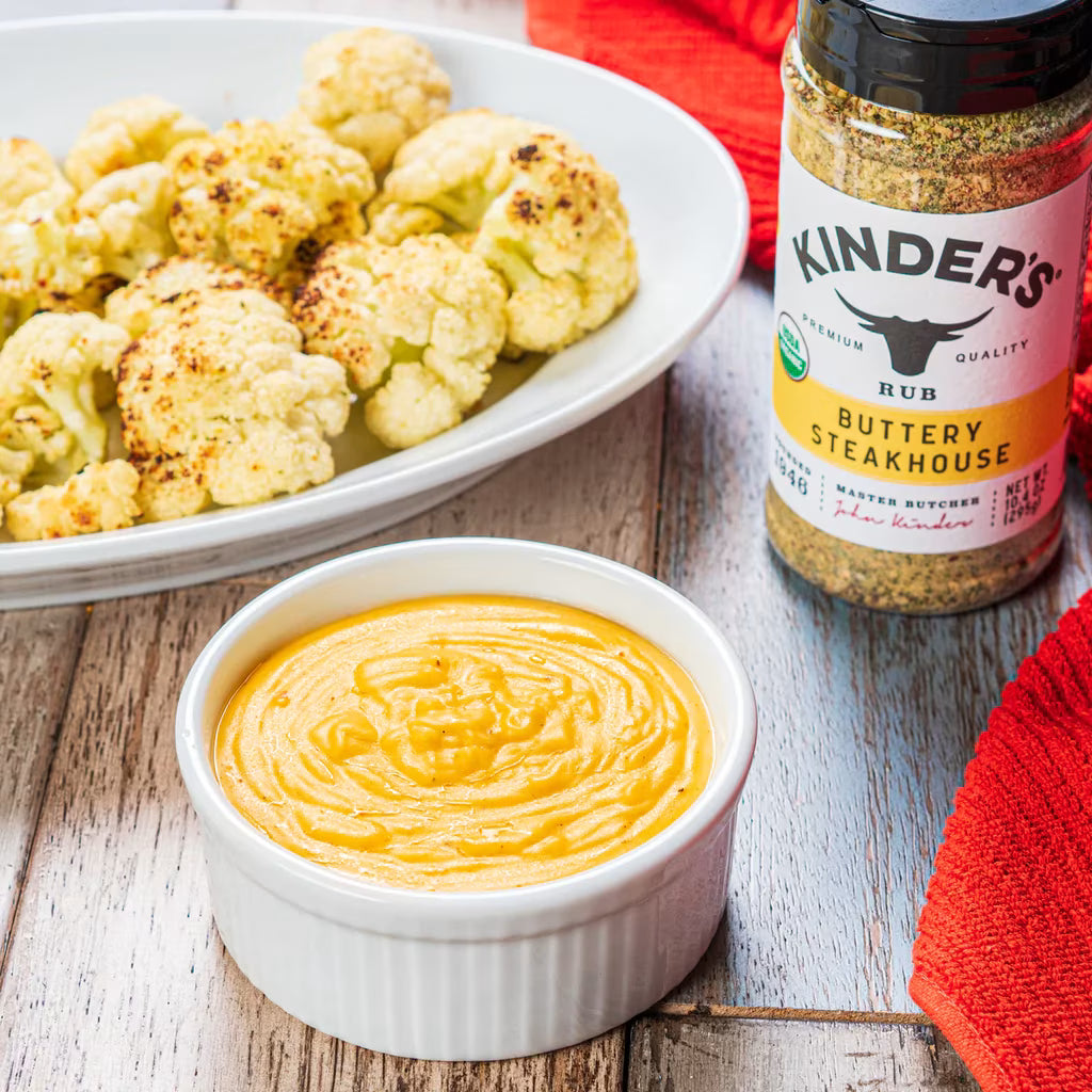 Lifestyle/use image: Kinder's Buttery Steakhouse Seasoning used on vegetables 295g