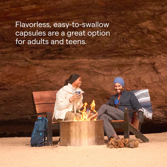 Two people sitting by a campfire with text about flavorless capsules.