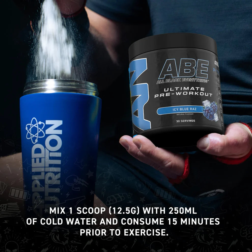 Applied Nutrition supplement container with ABE pre-workout powder being poured into it.