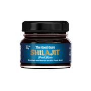 The Good Guru Purified Shilajit Resin in a 20g glass jar on a white background.
