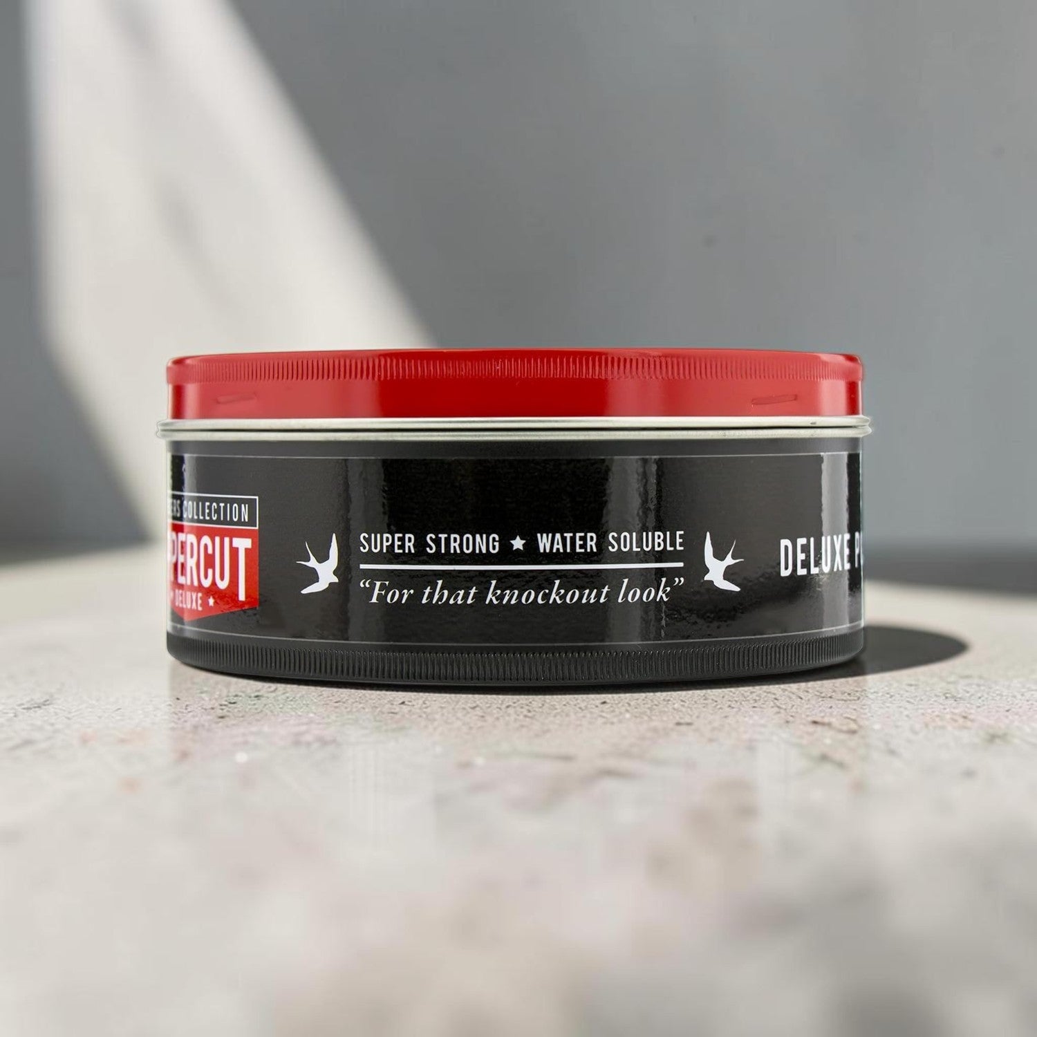 Uppercut Deluxe Pomade 100g jar strong hold high shine styling product packaging