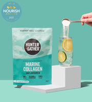 Hunter & Gather marine collagen powder packaging with a glass of water and lemon on a teal background.