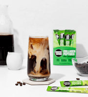 Glass of iced coffee with a box of Hunter Gather Collagen Peptides in the background.