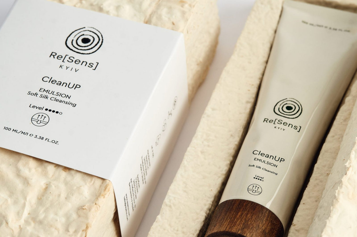 Re[Sens] skincare product with packaging on a textured surface