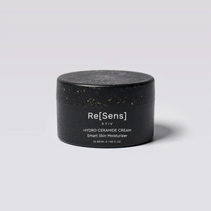 Black jar of Re[Sens] hydro ceramide cream on a light gray background