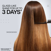 Redken Gloss Treatment being applied to mid-lengths of hair.