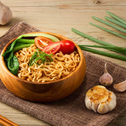 Lifestyle/use image: Kungfood noodles bowl with roasted garlic flavour prepared 10 pack