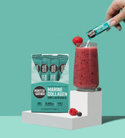 Hunter and Gather Marine Collagen packaging with a glass of a red smoothie and a strawberry on a teal background.